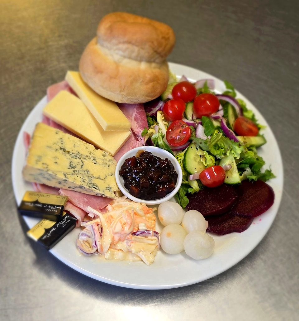 Ploughman's lunch with cheese, ham, salad and fresh bread at Swan Inn Abbotsbury